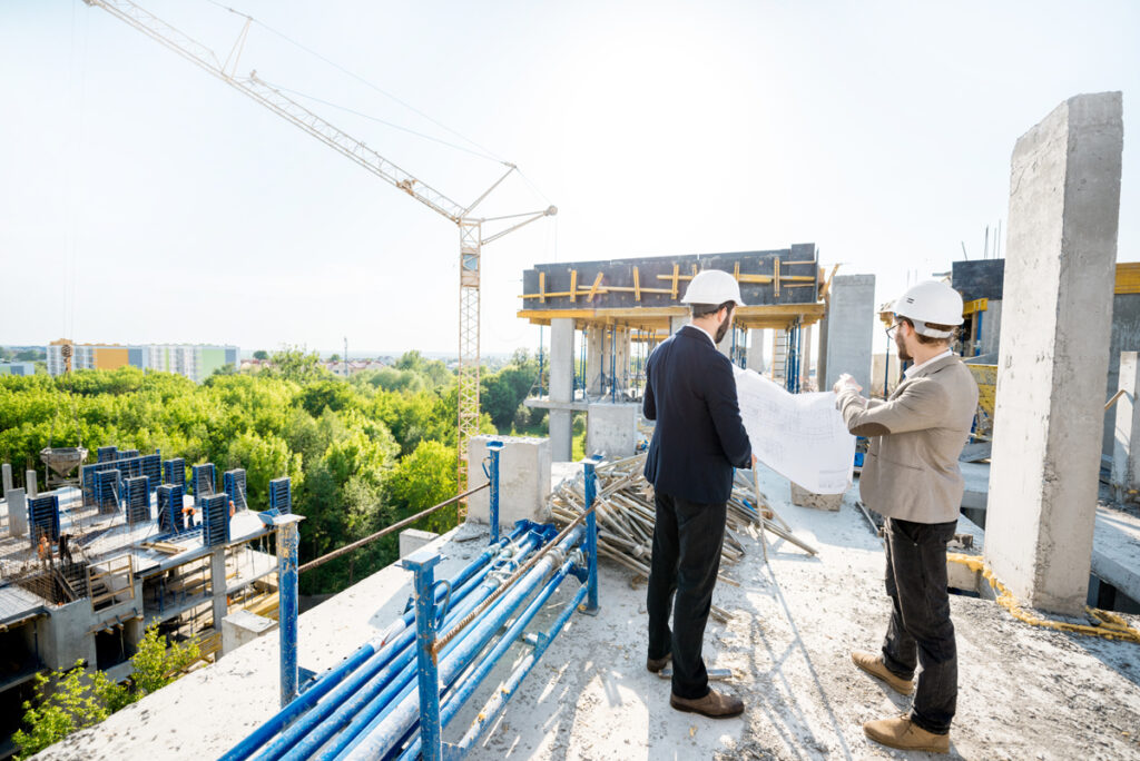 engineers-reviewing-building-plans-at-construction-2026-03-23-23-49-45-utc