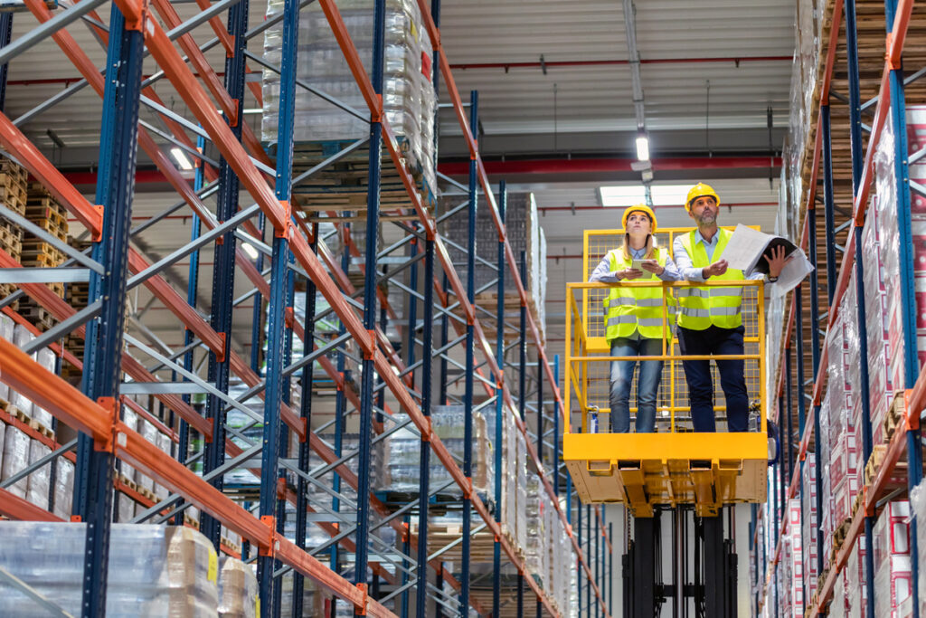 warehouse-workers-on-lift-work-platform-checking-i-2026-01-05-23-13-26-utc